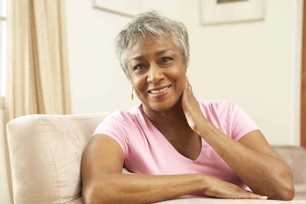 Senior Woman Relaxing In Chair At Home Senior Woman Relaxing In Chair At Home